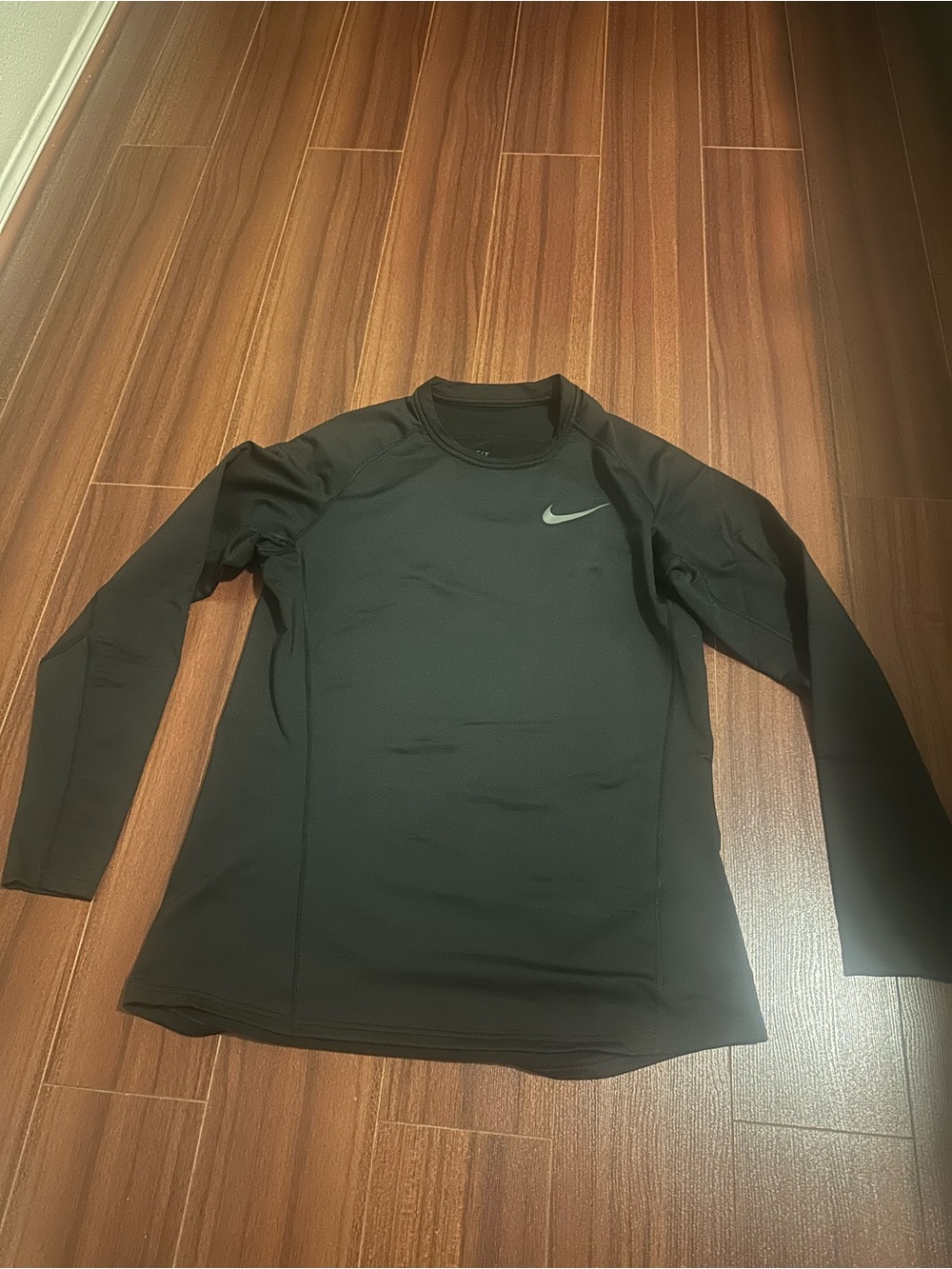 Nike Black Long Sleeve Performance Top with Silver Swoosh